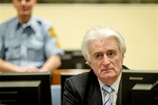 CORRECTS YEAR IN DATE  Bosnian Serb wartime leader Radovan Karadzic in the courtroom for the reading of his verdict at the International Criminal Tribunal for Former Yugoslavia (ICTY) in The Hague, The Netherlands Thursday March 24, 2016.The former Bosnian-Serbs leader is indicted for genocide, crimes against humanity, and war crimes. (Robin van Lonkhuijsen, Pool via AP)