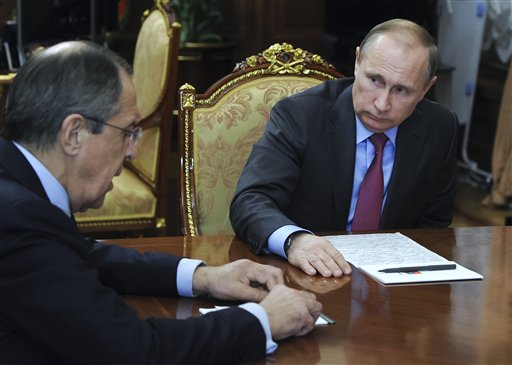 Russian President Vladimir Putin, right, listens to Russian Foreign Minister Sergey Lavrov during their meeting in the Kremlin in Moscow, Russia, Monday, March 14, 2016. Russian President Vladimir Putin has ordered the start of the pullout of the Russian military from Syria starting Tuesday. (Mikhail Klimentyev/Sputnik, Kremlin Pool Photo via AP)