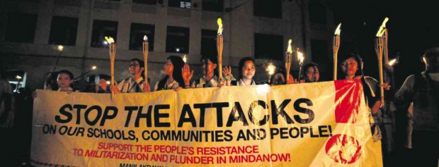 STUDENTS and indigenous peoples from Mindanao carry torches during a march in Manila recently against attacks on “lumad” communities allegedly by militias being backed by the military. INQUIRER PHOTO