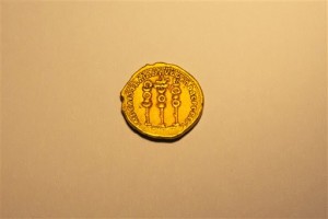 A rare, nearly 2,000-year-old gold coin, at the Antiquities Authority office inside the Israel Museum in Jerusalem, Monday, March 14, 2016. Israel's Antiquities Authority says a hiker has found a rare, nearly 2,000-year-old gold coin. The authority said Monday that the ancient coin appears to be only the second of its kind to have been found. It said London's British Museum possesses the other coin. (AP Photo/Ariel Schalit)