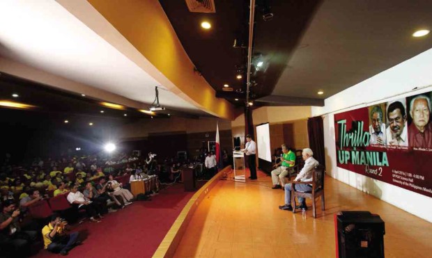 THRILLING ONLY FOR TWO  Manila Rep. Amado Bagatsing (seated onstage, with microphone) and former mayor Alfredo Lim (right) discuss their platforms during Wednesday’s “debate” at the UP-PGH Science Hall. It was supposed to feature  the three main contenders for the city’s top post, but reelectionist Mayor Joseph Estrada did not attend. RICHARD REYES