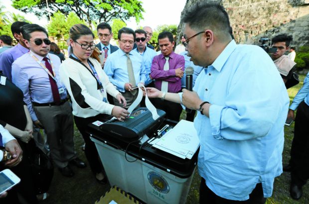 Commission on Elections (COMELEC) spokesman James Jimenez shows how the voting machine works during the special demonstration for diplomats of the vote counting machine to be used in the 2016 National and Local Elections at the Baluarte de San Diego Gardens in Intramuros, Manila on Monday, April 4, 2016. INQUIRER PHOTO / GRIG C. MONTEGRANDE