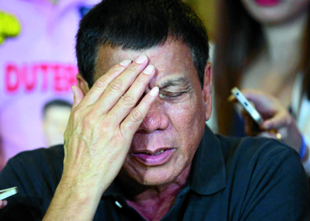 April 29, 2016 DUTERTE- Davao Mayor Rodrigo Duterte reacts after being questioned about his bank accounts at the Golden Bay Restaurant in Pasay City, after a brief appearence with close allies.  INQUIRER/ MARIANNE BERMUDEZ