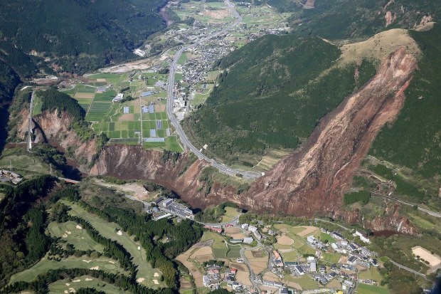 A landslide is seen after the earthquake in Minamiaso, Kumamoto prefecture, southern Japan Saturday, April 16, 2016. A powerful earthquake struck southern Japan early Saturday, barely 24 hours after a smaller quake hit the same region. Kyodo News via AP