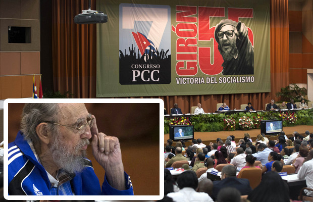 Fidel Castro, sitting sixth from right, listens to his brother, Cuba's President Raul Castro, who speaks during the closing ceremony of the 7th Congress of the Cuban Communist Party in Havana, Cuba, Tuesday, April 19, 2016. The photo hanging behind is of Fidel Castro, and reads in Spanish "Socialism Victory." Fidel Castro formally stepped down in 2008 after suffering gastrointestinal ailments and public appearances have been increasingly unusual in recent years. (Ismael Francisco/Cubadebate via AP)