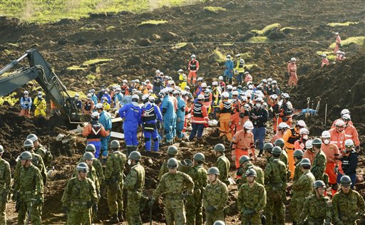 Rescuers search for missing persons at the site of a landslide in Minamiaso, Kumamoto prefecture, Japan Wednesday, April 20, 2016. Searchers continue digging in southern Japan where twin earthquakes triggered landslides. (Hiroko Harima/Kyodo News via AP) JAPAN OUT, MANDATORY CREDIT