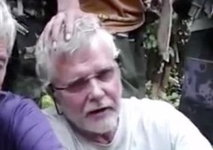 This image made from undated militant video, shows Canadians John Ridsdel, right, and Robert Hall. Canada's Prime Minister Justin Trudeau confirmed that the decapitated head of a Caucasian male recovered Monday, April 25, 2016, in the southern Philippines belongs to Ridsdel, who was taken hostage by Abu Sayyaf militants in September 2015. (Militant Video via AP Video) NO SALES, MANDATORY CREDIT