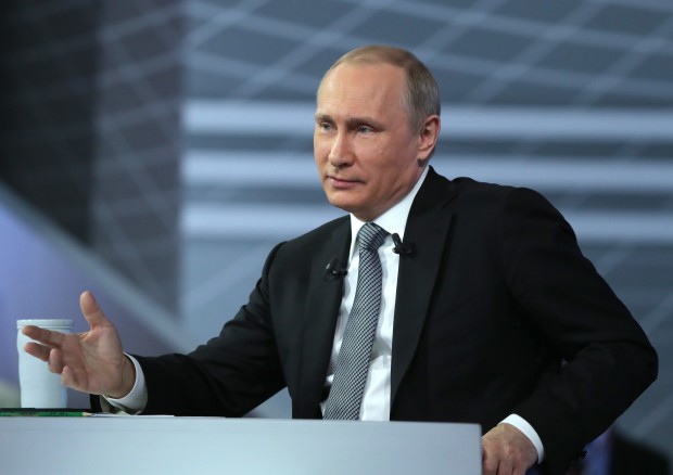 Russian President Vladimir Putin gestures while speaking during his annual call-in show in Moscow, Russia, Thursday, April 14, 2016. The Kremlin has been sifting through more than 1 million questions from across the country to get Putin ready for the television marathon. (Mikhail Klimentyev/Sputnik, Kremlin Pool Photo via AP)