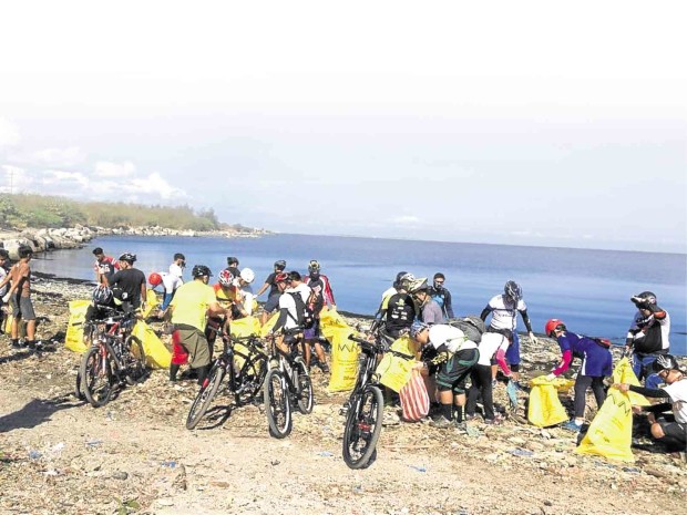 Environmentalists take to their bikes but do not forget their trash bags as they push for the preservation of the Las Piñas-Parañaque Critical Habitat and Ecotourism Area, a sanctuary threatened by proposed government reclamation projects. CONTRIBUTED BY NILAD’S KATHY YAMZON