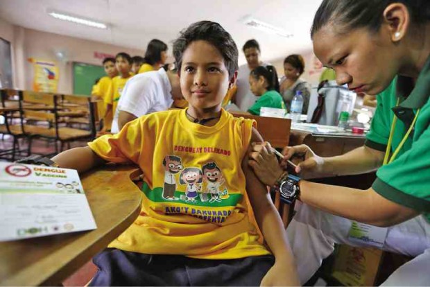 WHILE others cried, grimaced in pain or hid their faces in their hands to avoid seeing the needle, a student of Parang Elementary School in Marikina City is a picture of calmness as he is injected with the dengue vaccine.   NIÑO JESUS ORBETA FILE PHOTO