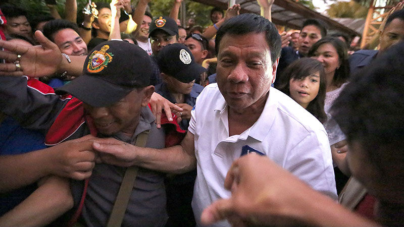 BATANGAS STUMP Presidential candidate Rodrigo Duterte is greeted by supporters at Lipa City Hall during a campaign rally in Batangas City. RAFFY LERMA