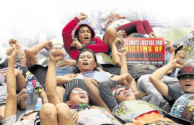 MEMBERS of militant groups hold a die-in protest on Mendiola Bridge in Manila to express support for hundreds of farmers demanding food aid who were dispersed violently in Kidapawan City. At least two farmers were killed and dozens were wounded during the operation to clear the road of farmers. MARIANNE BERMUDEZ