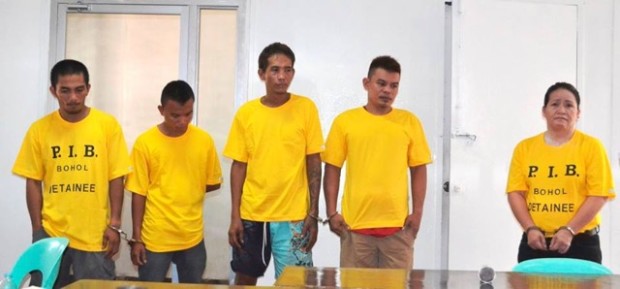 Alleged “drug queen” Maida Quimson Jabines (right) and her four suspected drug runners are presented to the media in Bohol on Saturday. At least 2.2 kilos of “shabu” worth P25.9 million are seized in a raid conducted on Jabines’ rented apartment on Friday afternoon. CONTRIBUTED PHOTO/RIC OBEDENCIO