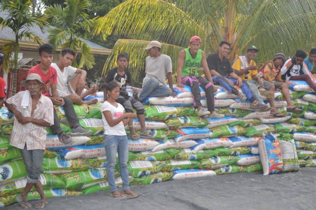 APRIL 2, 2016 Protesters sit on the files of bags of rice inside the United Methodist Church in Kidapawan City. Action star Robin Padilla visited the protesters on Saturdat afternoon and donate at least 200 bags of commercial rice to the hungry protesters. (Williamor A. Magbanua)