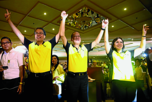 RALLYING LP TROOPS FOR MAR, LENI “We will win because we’re not corrupt.We will win because we don’t act like dictators,” declares Liberal Party standard-bearer Mar Roxas at the show of force by the ruling party and allies at Club Filipino in Greenhills, San Juan City, on Thursday. President Aquino raised the hands of Roxas and his running mate Leni Robredo. MALACAÑANG PHOTO BUREAU