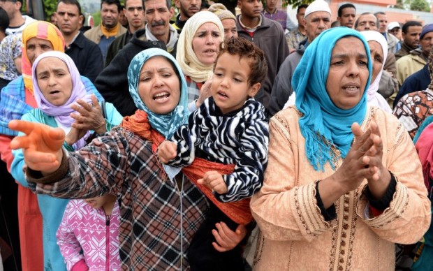 Moroccan protesters living in the neighborhood where two men presumed to be homosexual have been assaulted last month, demonstrate against homosexuality and in support of family members who are on trial in connection with the assault, on April 11, 2016, outside the court in the central city of Beni Mellal.  The trial reopened in central Morocco of a homosexual and three men who allegedly attacked him, as two topless Femen activists were detained while demanding that Rabat decriminalize homosexuality. AFP PHOTO