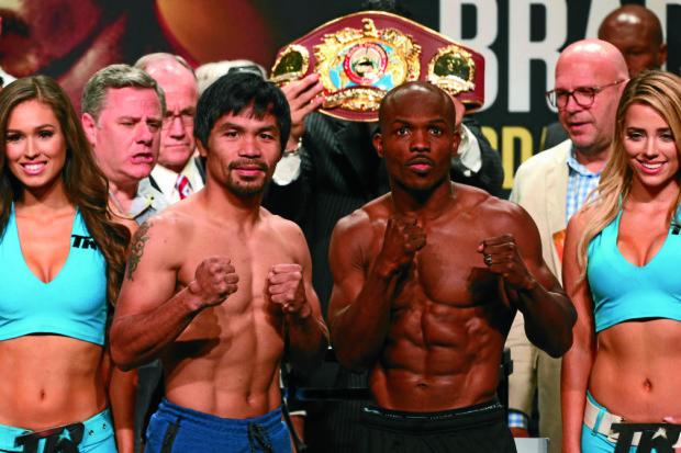 Manny Pacquiao and Timothy Bradley Jr. during the official weigh in at the MGM Grand Garden Arena in Las Vegas, April 8, 2016. Pacquiao weighed 145.5lbs while Bradley weighed 146.5lbs.     PHOTO BY REM ZAMORA