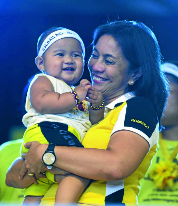 YOUNG SUPPORTER  Liberal Party vice presidential candidate Leni Robredo cuddles 1-year-old Rodsam Jay, the son of a Sumilao farmer, at Quezon Memorial Circle on Friday.   RAFFY LERMA