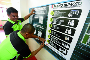 ELECTION PREPARATIONS / MAY 7, 2016 Teachers install election guidelines posters at Cubao Elementary School, Quezon City May 7, 2016, before the election day on May 9. INQUIRER PHOTO / NINO JESUS ORBETA
