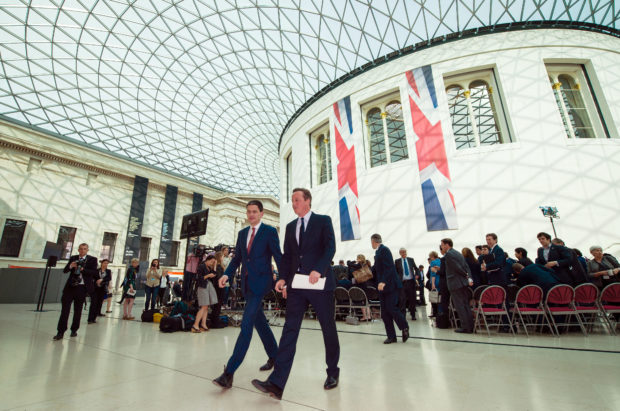 Britain's Prime Minister David Cameron, right, leaves after delivering a speech on the European Union with former foreign minister of the last Labour government David Miliband, at the British Museum in central London, Monday May 9, 2016. Raising the stakes in Britain's European Union membership debate, Prime Minister David Cameron said Monday that leaving the bloc would increase the risk of war in Europe. (Leon Neal/Pool via AP)