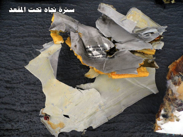 FILE - This picture posted Saturday, May 21, 2016, on the official Facebook page of the Egyptian Armed Forces spokesman shows a life vest from EgyptAir flight 804 in Egypt. Human remains retrieved from the crash site of EgyptAir Flight 804 suggest there was an explosion on board that may have brought down the aircraft in the east Mediterranean, a senior Egyptian forensics official said on Tuesday, May 24, 2016. Arabic reads, "Under the seat life vest." (Egyptian Armed Forces via AP, File)