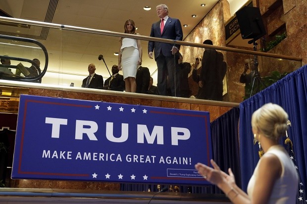 In this June 16, 2015, file photo, Donald Trump, accompanied by his wife Melania Trump, is applauded by his daughter Ivanka Trump, right as he's introduced before his announcement that he will run for president in the lobby of Trump Tower in New York. In AP's delegate count, Donald Trump surpassed the number needed to give him the nomination. That essentially closed out a raucous race on a quiet note, as a small number of unbound delegates put him over the top by telling AP they had decided to support him. AP  FILE PHOTO