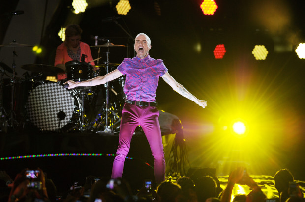 FILE - In this June 28, 2014 file photo, Neon Trees frontman Tyler Glenn performs at the iHeartRadio Ultimate Pool Party at Fontainebleau's BleauLive at Fontainebleau Miami Beach in Miami Beach, Fla. Two years after coming out as gay and praising the Mormon church for offering support, Glenn is denouncing his faith in his latest music video. The lead singer of the Provo-based band released the video Friday, April 29, 2016 for a single titled "Trash," in which he appears to be trashing the church. (Photo Jeff Daly/Invision/AP, File)