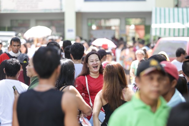 A woman laughs after she finished voting. Photo by Tristan Tamayo/INQUIRER.net