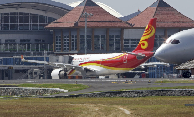 Hong Kong Airlines' Airbus A330-200 sits on the tarmac as the passenger plane returns to Ngurah Rai international airport after it ran into a severe turbulence in Bali, Indonesia, Saturday, May 7, 2016. The plane carrying 204 passengers and 12 crewmen encountered the turbulence above Kalimantan, Indonesia’s part of Borneo, while flying from Bali island to Hong Kong. (AP Photo/Firdia Lisnawati)
