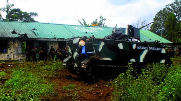 BATTLE SCENE Soldiers of the 103rd Infantry Brigade occupy the Ragayan Elementary School after an intense battle with gunmen belonging to theMaute criminal group in Barangay Ragayan in Butig, Lanao del Sur province. RICHEL V. UMEL / INQUIRER MINDANAO