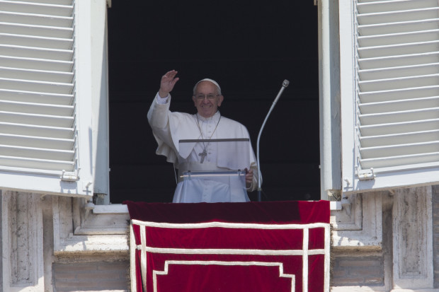 Pope Francis delivers his blessing during the Angelus noon prayer he celebrated from the window of his studio overlooking St.Peter's Square, at the Vatican, Sunday, May 22, 2016. Francis, addressing tens of thousands of tourists and pilgrims in St. Peter’s Square Sunday, expressed his hopes for an humanitarian summit opening the next day in Istanbul. (AP Photo/Andrew Medichini)