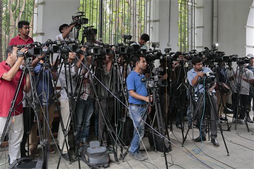 Bangladeshi journalists cover proceedings  outside a court in Dhaka, Bangladesh, Tuesday, May 3, 2016. Tuesday marks World Press Freedom Day. (AP Photo/ A.M. Ahad)