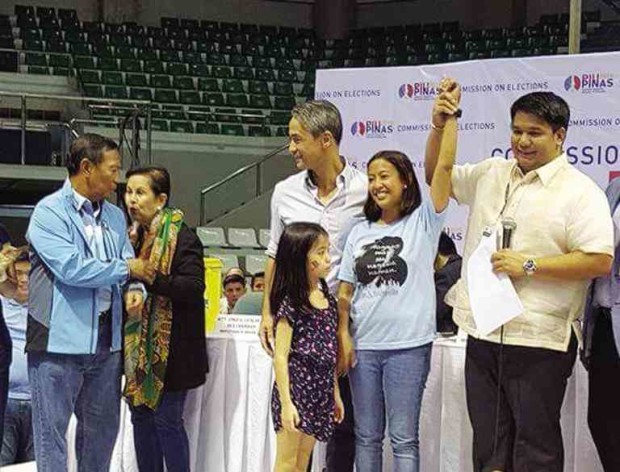 DAUGHTER’S TURN  Makati Rep. Abigail Binay (hand raised) is proclaimed as new city mayor on Tuesday. Behind her is husband Luis Campos, who will succeed her at the House. Joining in the celebration (left) are her parents, Vice President Jejomar and former Makati Mayor Elenita Binay. JOHN CYRIL YEE