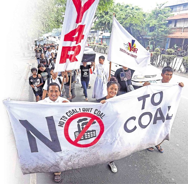 SOME of the march participants walk to Cebu City to remind incoming members of the city council to stand by a resolution rejecting a proposed coal power plant in a village in the city.            LITO TECSON/CEBU DAILY NEWS