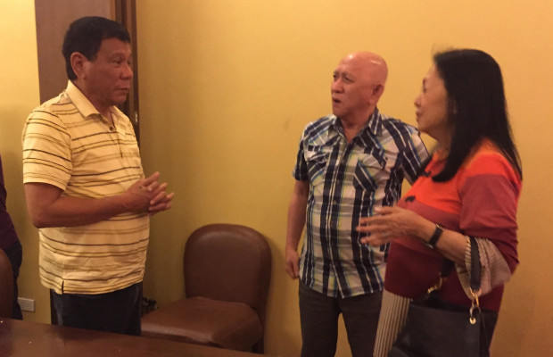 Incoming President Rodrigo Duterte chats with NDFP peace panel spokesperson Fidel Agcaoili and wife Chit in Davao City on Wednesday evening. KARLOS MANLUPIG/INQUIRER MINDANAO 