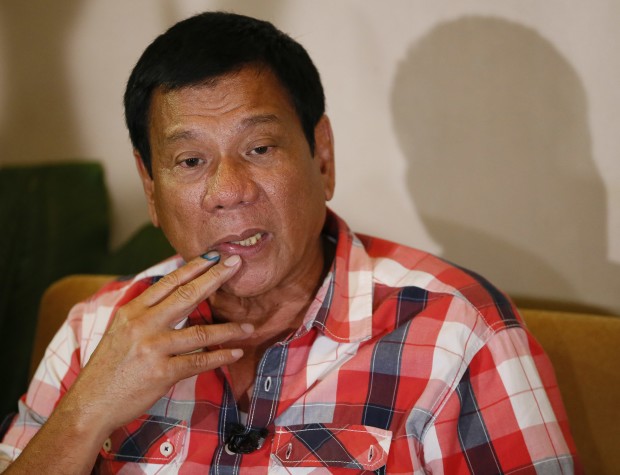 In this Monday, May 9, 2016 photo, front-running presidential candidate Mayor Rodrigo Duterte answers questions from the media during a news conference shortly after voting at his hometown in Davao city in southern Philippines. Philippine lawmakers say Rodrigo Duterte has been elected president and Leni Robredo elected vice president in official vote count. (AP 