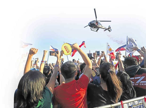 THOUSANDS of supporters of incoming President Rodrigo Duterte in Cebu City raise their fists, mimicking the gesture of the winner in the presidential race during the campaign which many took to mean as determination in the fight against criminality. LITO TECSON/CEBU DAILY NEWS