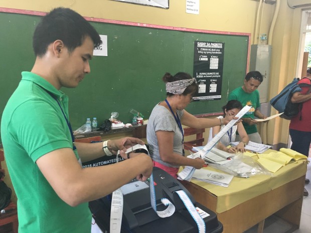 Board of election inspectors process the transmission of election results at a precinct in Manuel Roxas High School in Paco, Manila. ANTHONY Q. ESGUERRA/INQUIRER.net 