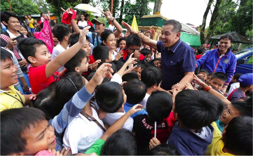 Martin Romualdez greets supporters during a visit to Quezon Province.