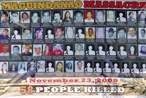 A TARPAULIN with the pictures of the 58 victims of the 2009 Maguindanao massacre hangs at the site of the mass murder in the town of Ampatuan, Maguindanao province during the commemoration of the sixth anniversary of the killings in November 2015. The case against those who perpetrated one of the country’s most horrific crimes remains pending in court.    JEOFFREY MAITEM / INQUIRER MINDANAO