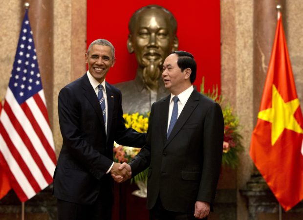 IMPROVED RELATIONS US President Barack Obama and Vietnamese President Tran DaiQuang shake hands before walking to a talk at the presidential palace in Hanoi on Monday. Obama announced the lifting of a US arms embargo on Vietnam, which could help counter China’s increasing aggressiveness in the South China Sea. AP