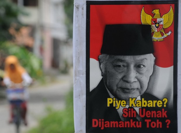 In this photograph taken on March 9, 2014, a poster bearing the portrait of the late Indonesian dictator Suharto with a slogan "How are you bro? Still better in my time, no?" is displayed in Karanganyar town in central Java island.  AFP FILE PHOTO 