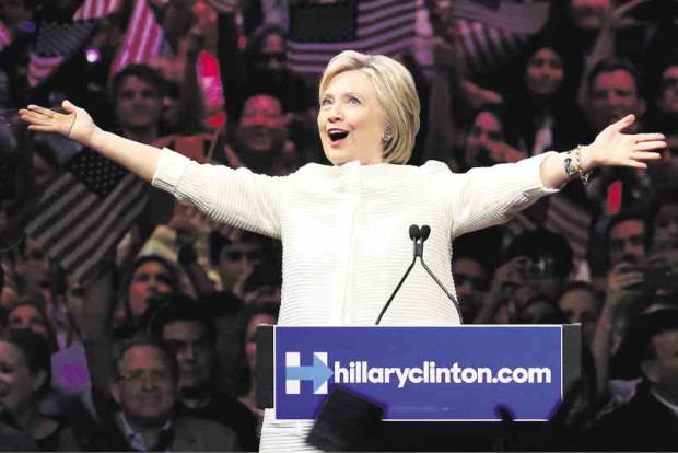  HER NIGHT Democratic presidential candidate Hillary Clinton gestures as she greets supporters at a presidential primary election night rally in New York on Tuesday. AP 