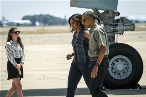 President Barack Obama and first lady Michelle Obama, arrive in Roswell, N.M., Friday, June 17, 2016, on their way to touring Carlsbad Caverns National Park.  The President is touring several of the nation's national parks to celebrate the 100th anniversary of the creation of America's national park system. (AP Photo/Juan Labreche)