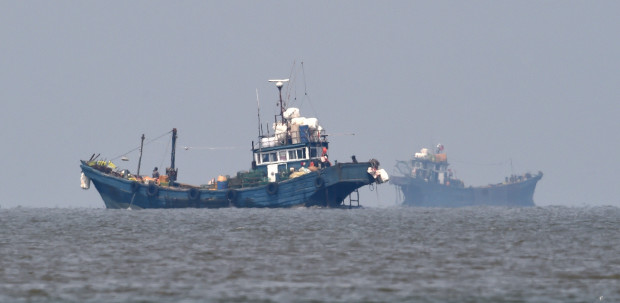 In this photo provided by the South Korean Defense Ministry, Chinese fishing boats are seen in neutral waters around Ganghwa island, South Korea, Friday, June 10, 2016. South Korean military vessels started an operation Friday to repel Chinese fishing boats illegally harvesting prized blue crabs from an area near Seoul's disputed sea boundary with North Korea. (The South Korean Defense Ministry via AP)