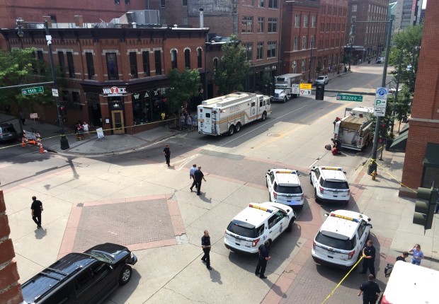 Police respond to reports of a shooting in Denver, Tuesday, June 28, 2016. Police say a gunman walked into a busy downtown Denver office building and shot multiple times before turning the gun on himself. (Eric Lutzens/The Denver Post via AP) MAGS OUT; TV OUT; INTERNET OUT; NO SALES; NEW YORK POST OUT; NEW YORK DAILY NEWS OUT; MANDATORY CREDIT