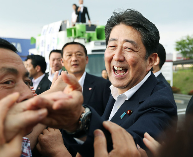 Japanese Prime Minister Shinzo Abe greets supporters during an election campaign for his ruling Liberal Demoicratic Party in Sukagawa, Fukushima prefecture, northeastern Japan, Wednesday, June 22, 2016. Japan's parliamentary election campaign kicked off Wednesday in the first nationwide balloting after the voting age was lowered to 18 from 20. (Kyodo News via AP) JAPAN OUT, CREDIT MANDATORY