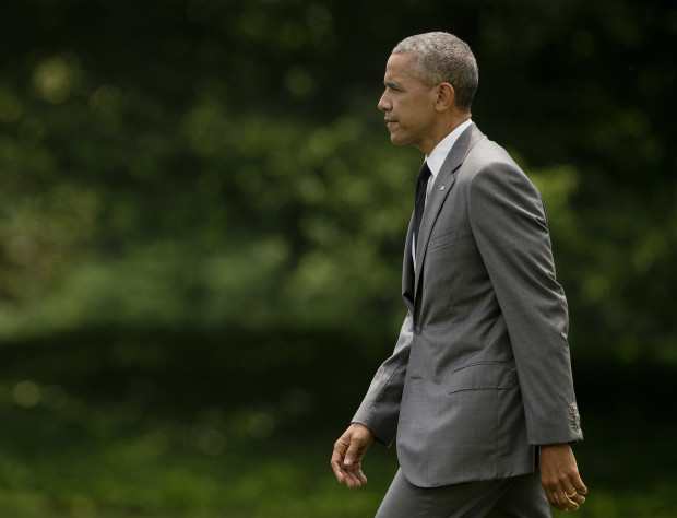 President Barack Obama walks across the South Lawn of the White House in Washington, Friday, June 3, 2016, before boarding the Marine One helicopter for the short ride to nearby Andrews Air Force Base, Md. Obama is traveling to Miami for a pair of Democratic fundraisers.(AP Photo/Pablo Martinez Monsivais)