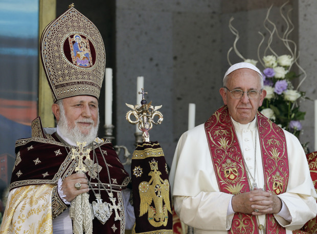 Pope Francis, right, participates in the Divine Liturgy celebrated by Catholicos Karekin II, left, at the Armenian Apostolic Cathedral in Etchmiadzin, Yerevan, Armenia, Sunday, June 26, 2016. Francis called Sunday for closer ties with Armenia's Orthodox church as he wrapped up his three-day visit with a liturgy and visit to the country's closed border with Turkey amid new tensions with Ankara over his recognition of the 1915 "genocide." (AP Photo/Andrew Medichini)