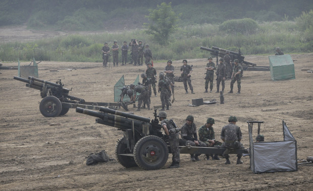 South Korean army soldiers prepare to fire 105mm howitzers during an exercise in Paju, South Korea, near the border with North Korea Wednesday, June 22, 2016. In a remarkable show of persistence, North Korea on Wednesday fired two suspected powerful new Musudan mid-range missiles, U.S. and South Korean military officials said, but at least one of the launches apparently failed, Pyongyang's fifth such reported flop since April. (AP Photo/Ahn Young-joon)